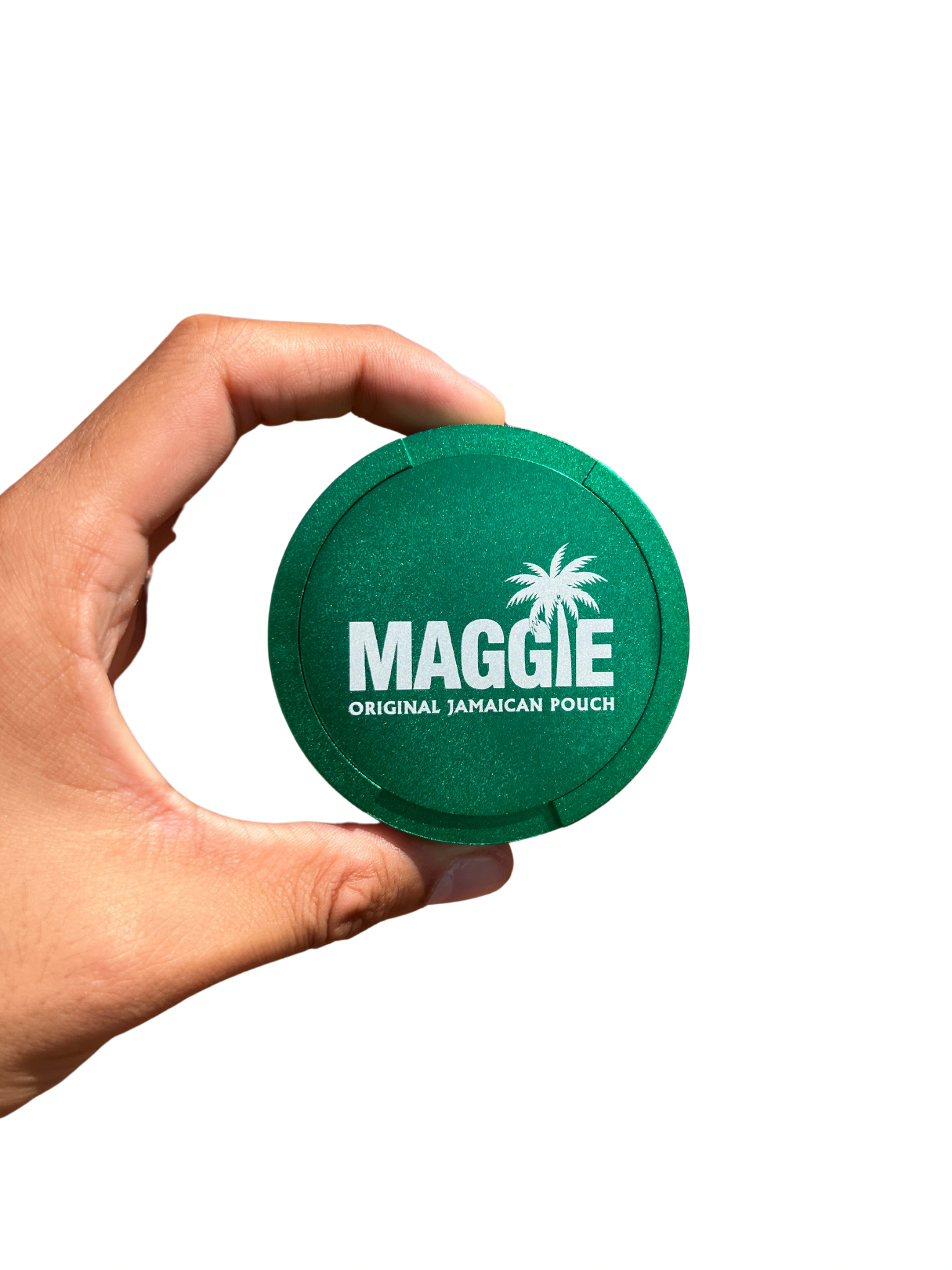 A hand holding the green Maggie Aluminium Pouch Case, a round metal nicotine pouch storage tin with a white logo.